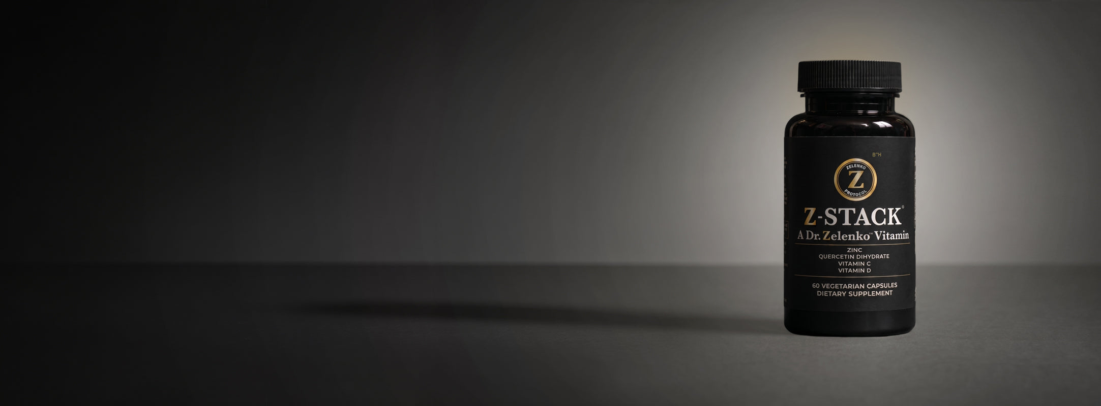 Z-Stack immune supplement bottle on a dark background