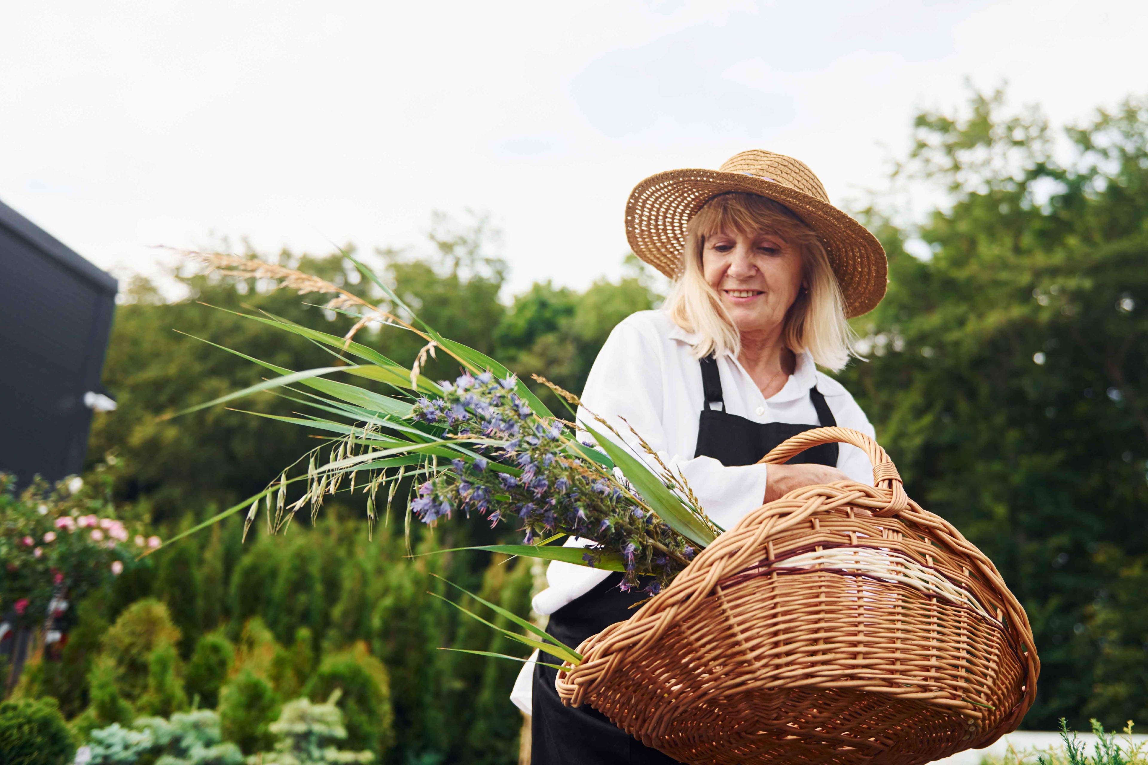 Lady with a wooden basket and wicker hat